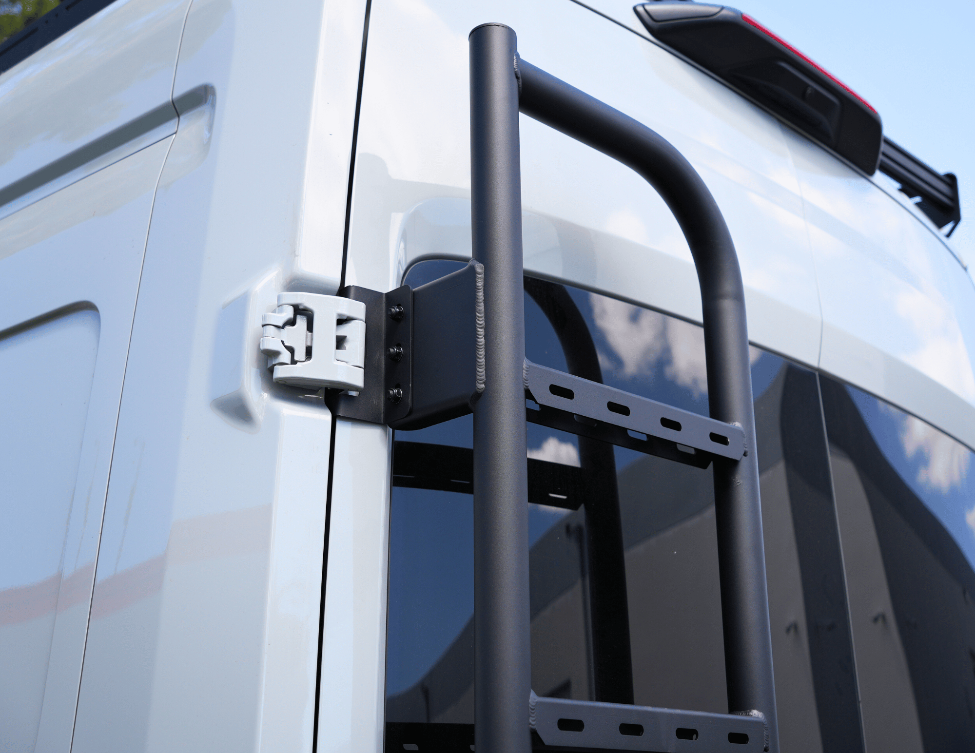 Transit Rear Tire Carrier Ladder - Out There Vans, LLC